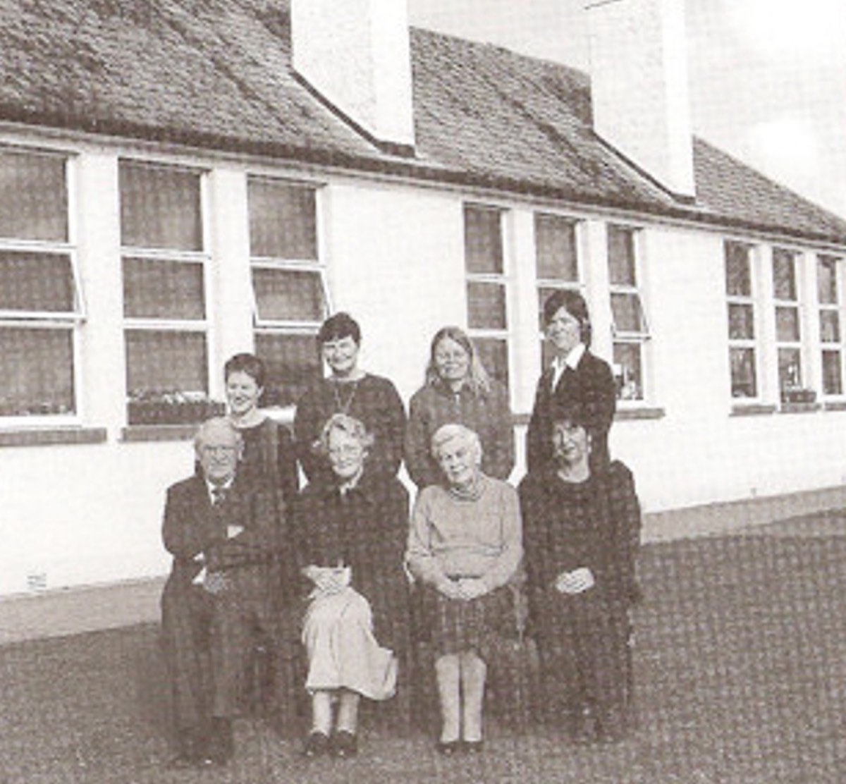 Teachers and pupils photographed outside the school in earlier years